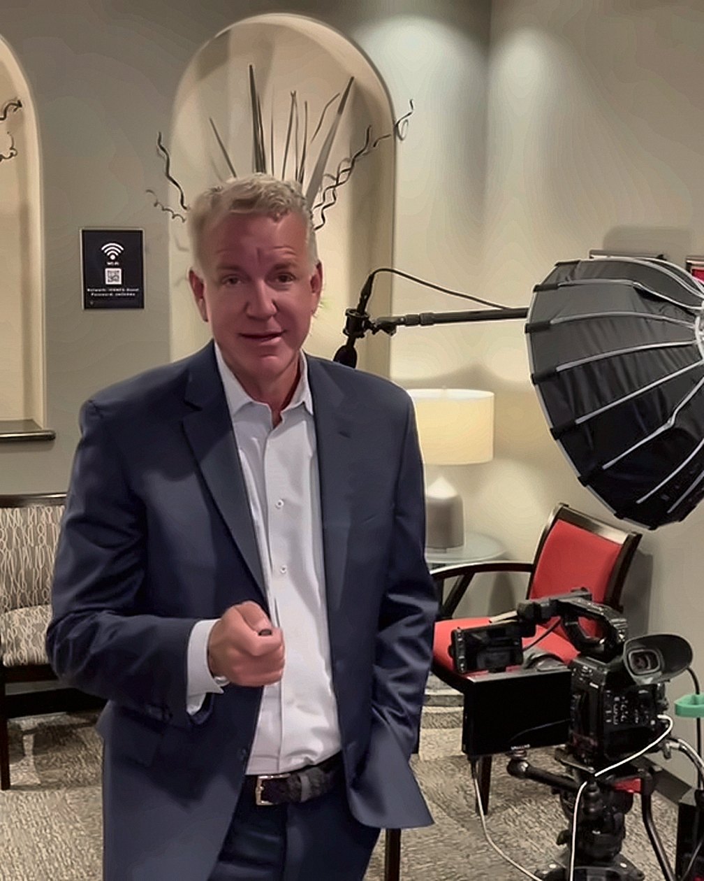 Marc speaking to camera on a video set