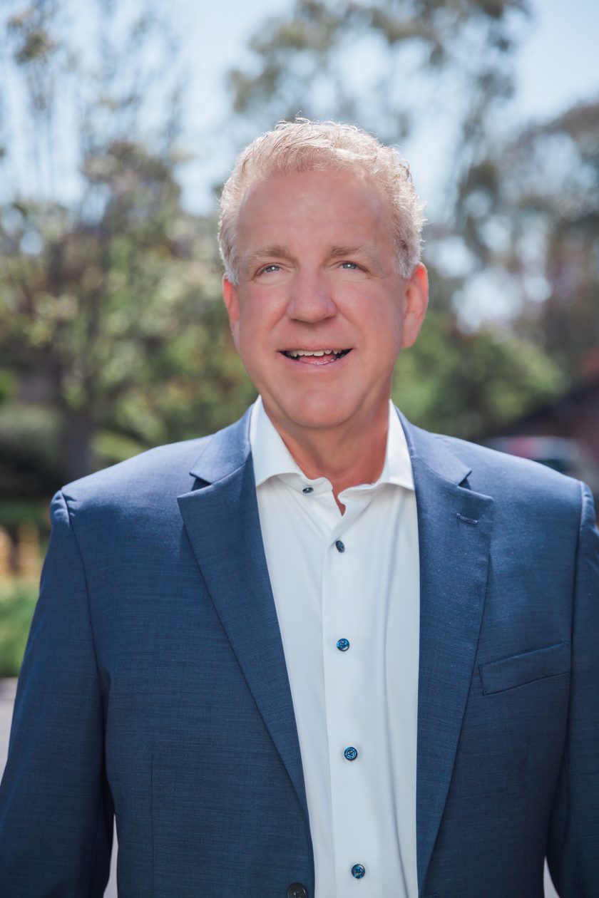 Marc Heffner outdoors in a navy blazer